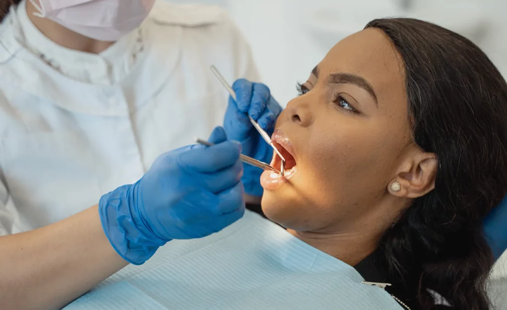Woman getting oral examination at the dentist