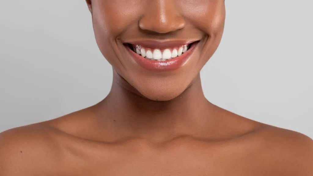 Woman smiling and showing her beautiful teeth